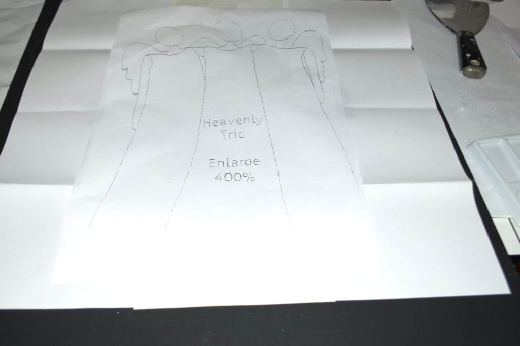 trace-the-pattern-onto-the-black-canvass Trace the Pattern onto the Black Canvass, Paint your Own Christmas Angels
