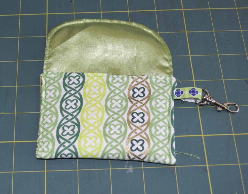 Turn the bottom half up toeard the top St. Patrick's Day Padded Pocket Rosary Pouch