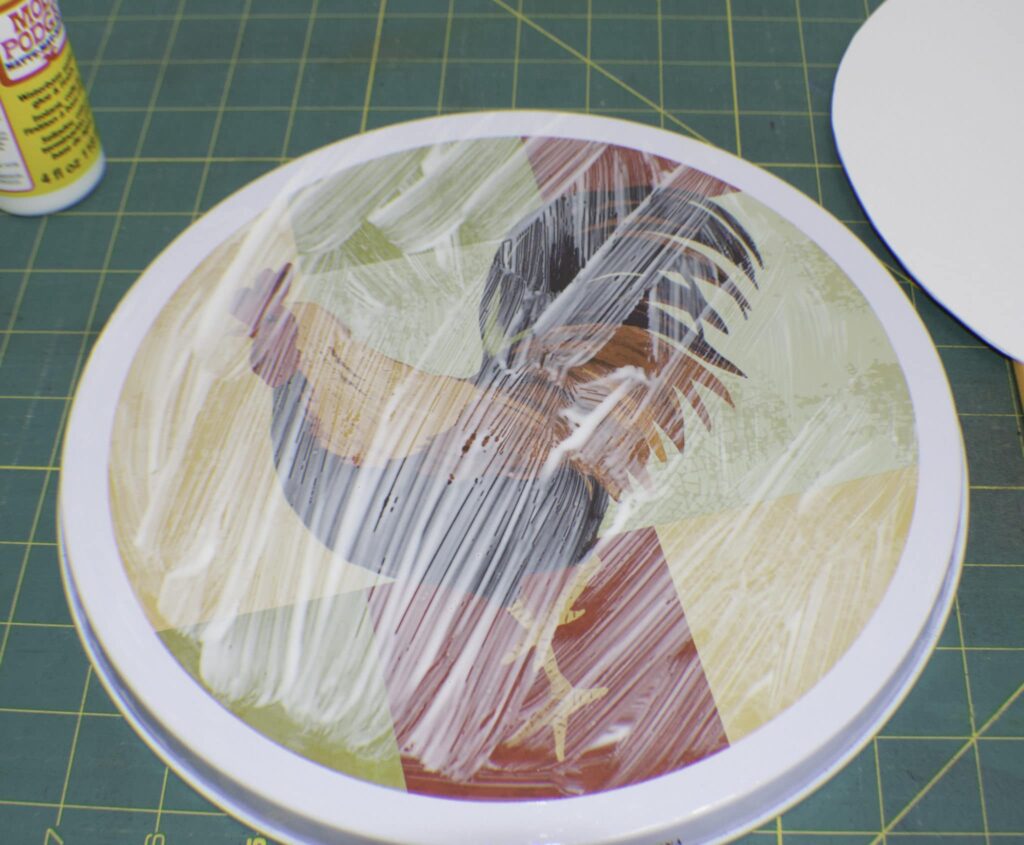 Brush The Modpoge onto the Stove Cover Upcycle Dollar Store Range Covers