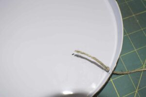 Drill the Holes and Add the Twine Upcycle Dollar Store Range Covers