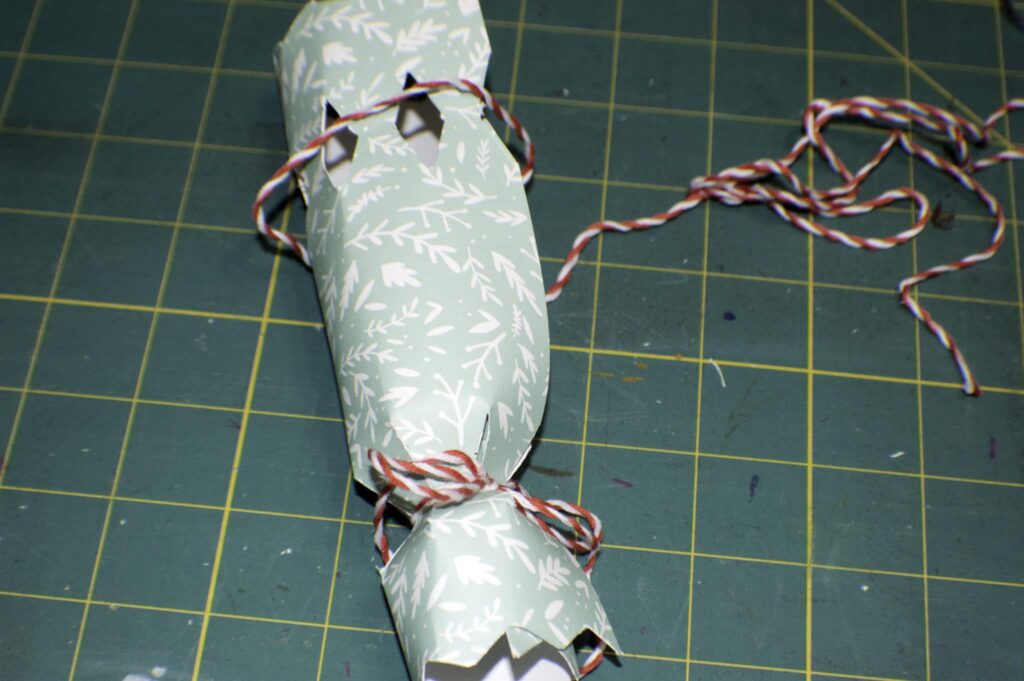 Roll the Paper so that the Diamonds can be Closed with Decorative String Mini Party Poppers