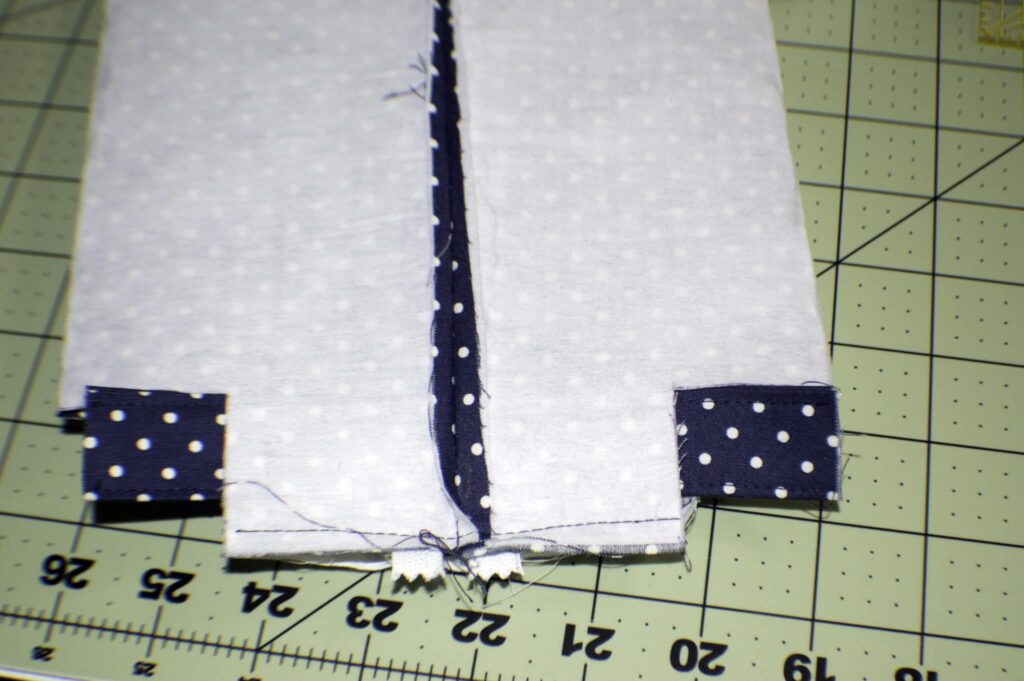 Place the Handle through the Holes in One of the Short Ends Boxy Zippered Pouch