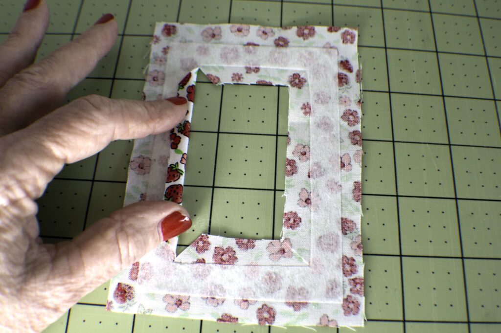 Fold back the inner cut of the pocket piece and press. How to sew a diy fabric luggage tag