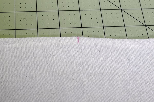 Make a drop cloth pom pom throw