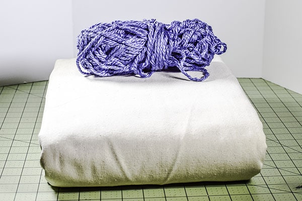 Make a drop cloth pom pom throw